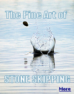 A smooth flat stone sitting on the beach is a stone thats meant to be thrown.